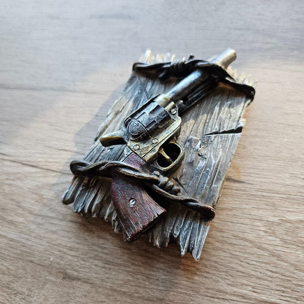 the old pistol paperweight